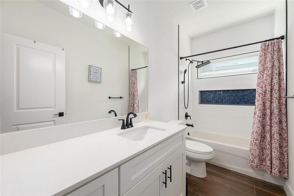 6659 Southwest 12th Lane Gainesville, FL 32607 - Photo 27 of 37 a bathroom with a sink a toilet and shower