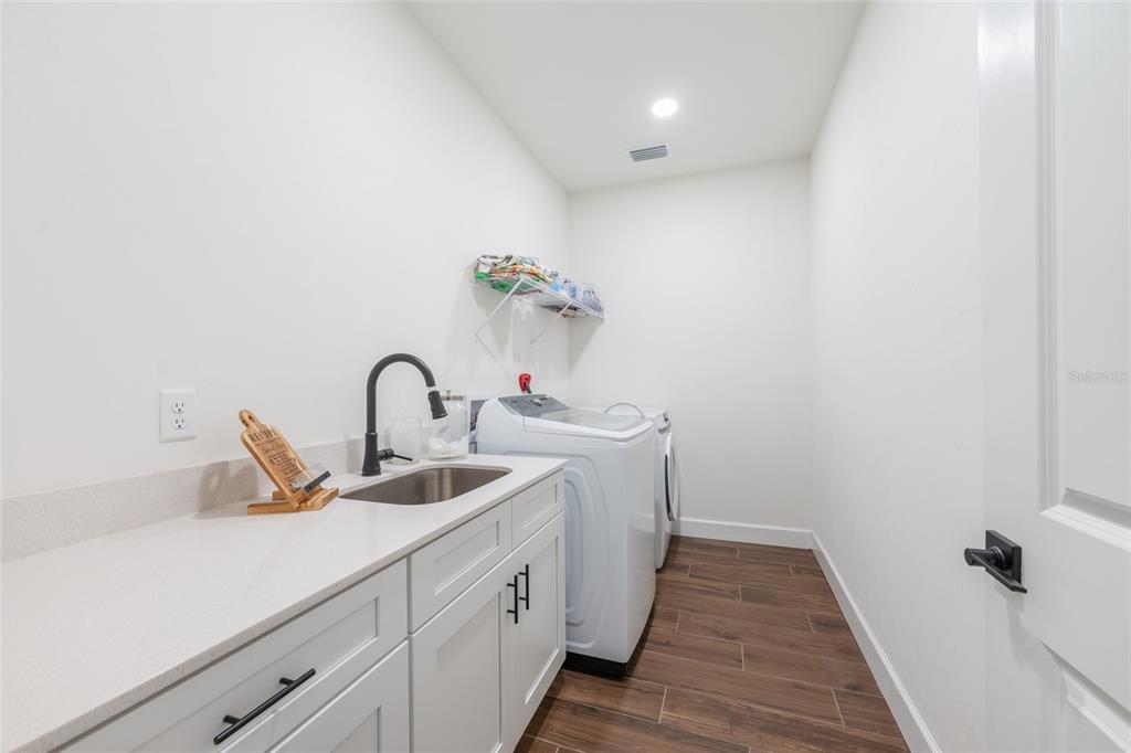 6659 Southwest 12th Lane Gainesville, FL 32607 - Photo 28 of 37 a bathroom with a sink and a mirror