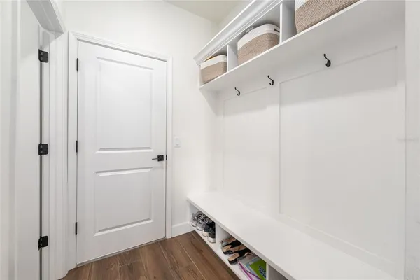a view of an entryway with wooden floor