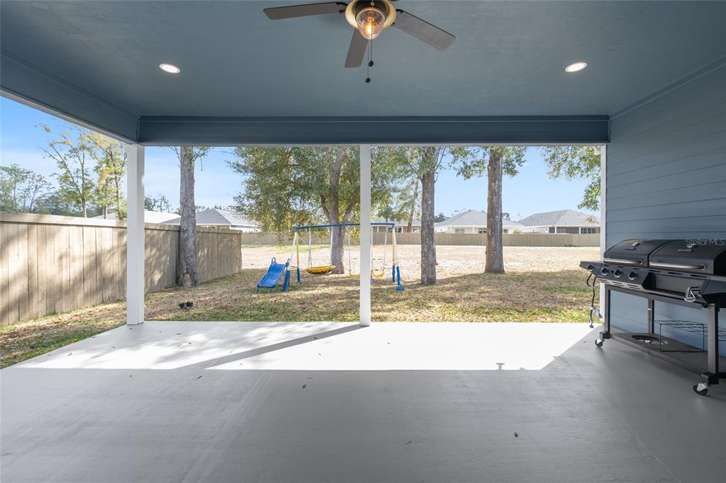 6659 Southwest 12th Lane Gainesville, FL 32607 - Photo 31 of 37 a view of a living room and a floor to ceiling window