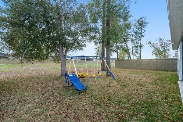 a view of a park with swings