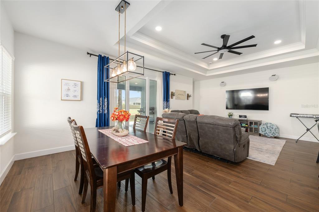 6659 Southwest 12th Lane Gainesville, FL 32607 - Photo 7 of 37 a view of a livingroom with furniture and a flat screen tv