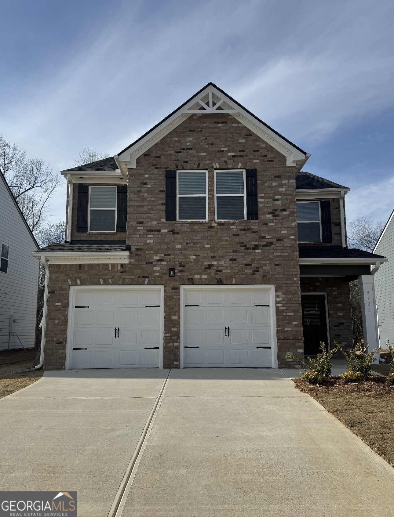 5306 Tolar Road, Unit 19 Fairburn, GA 30213 - Photo 1 of 1 a front view of a house with a garage
