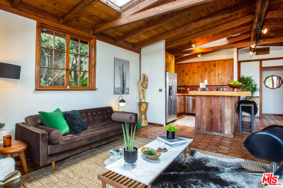 7280 Caverna Drive Los Angeles, CA 90068 - Photo 12 of 30 a living room with furniture and wooden floor