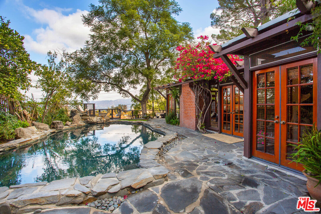 7280 Caverna Drive Los Angeles, CA 90068 - Photo 3 of 30 a view of a chairs and fire pit in the patio