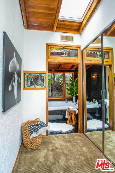 7280 Caverna Drive Los Angeles, CA 90068 - Photo 26 of 30 a living room with furniture and a floor to ceiling window