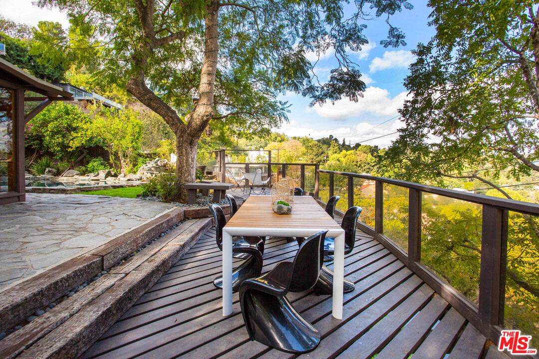 7280 Caverna Drive Los Angeles, CA 90068 - Photo 27 of 30 a view of a wooden deck with furniture