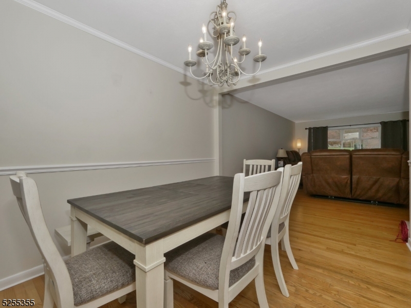 69 Intervale Road Boonton, NJ 07005 - Photo 11 of 29 a view of a dining room with furniture and chandelier
