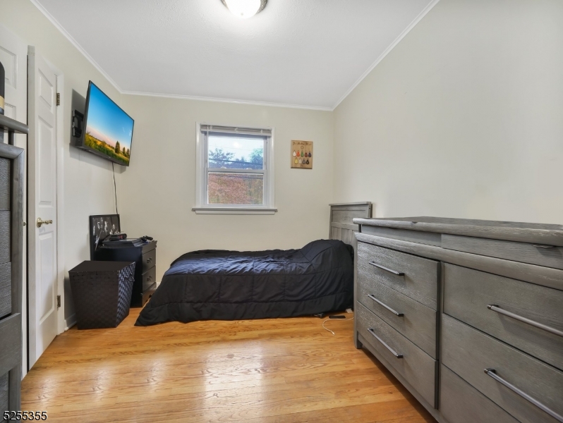 69 Intervale Road Boonton, NJ 07005 - Photo 14 of 29 a bedroom with a bed and a television