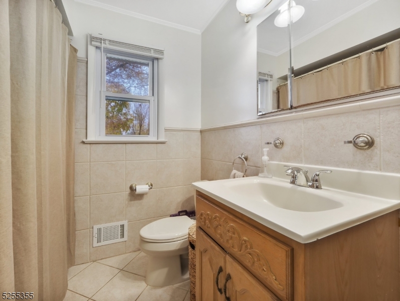 69 Intervale Road Boonton, NJ 07005 - Photo 17 of 29 a bathroom with a sink and a toilet