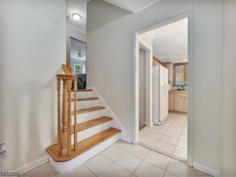 69 Intervale Road Boonton, NJ 07005 - Photo 18 of 29 a view of a hallway with entryway and hall with wooden floor