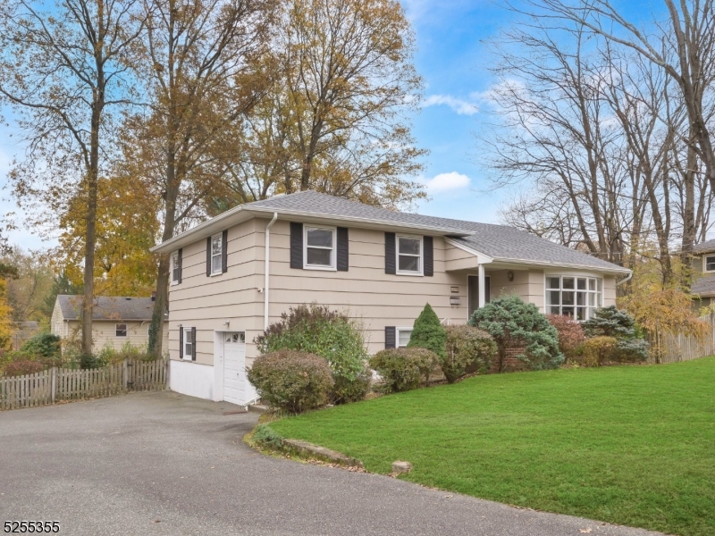 69 Intervale Road Boonton, NJ 07005 - Photo 24 of 29 a front view of a house with a garden
