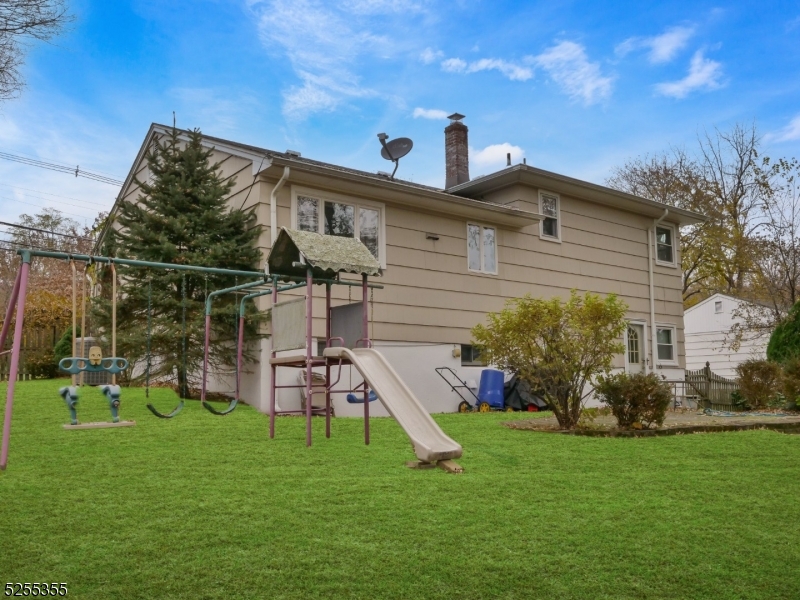 69 Intervale Road Boonton, NJ 07005 - Photo 26 of 29 a front view of a house with a yard