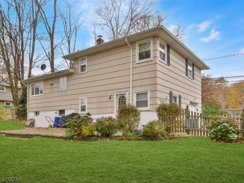 69 Intervale Road Boonton, NJ 07005 - Photo 28 of 29 a front view of a house with a garden
