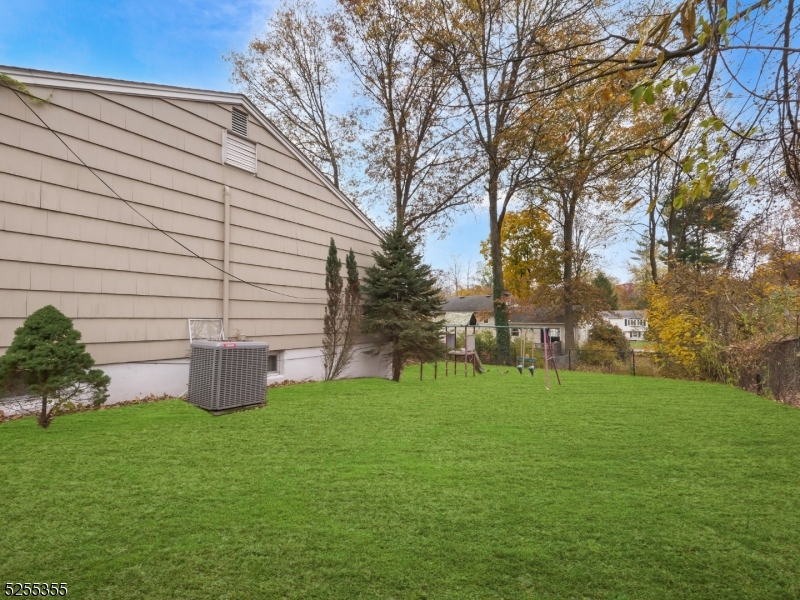 69 Intervale Road Boonton, NJ 07005 - Photo 29 of 29 a backyard of a house with table and chairs