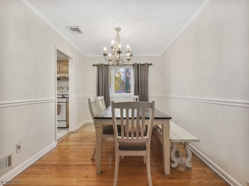 69 Intervale Road Boonton, NJ 07005 - Photo 10 of 29 a view of a dining room with furniture window and wooden floor