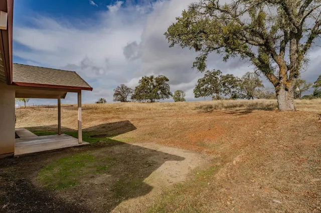 a backyard of a house with lots of green space