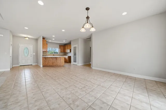 a view of a kitchen with a sink and a large window