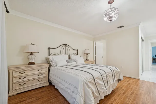 a bedroom with a bed and cabinets