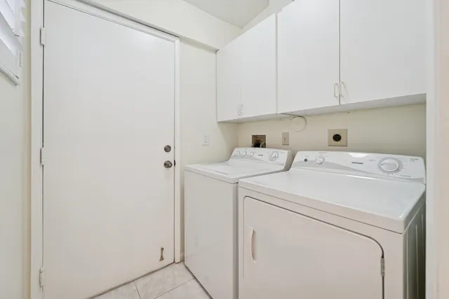 a lobby with furniture and a potted plant