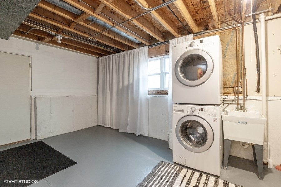 136 Tree Line Antioch, IL 60002 - Photo 15 of 17 a view of a storage & utility room with dryer and washer