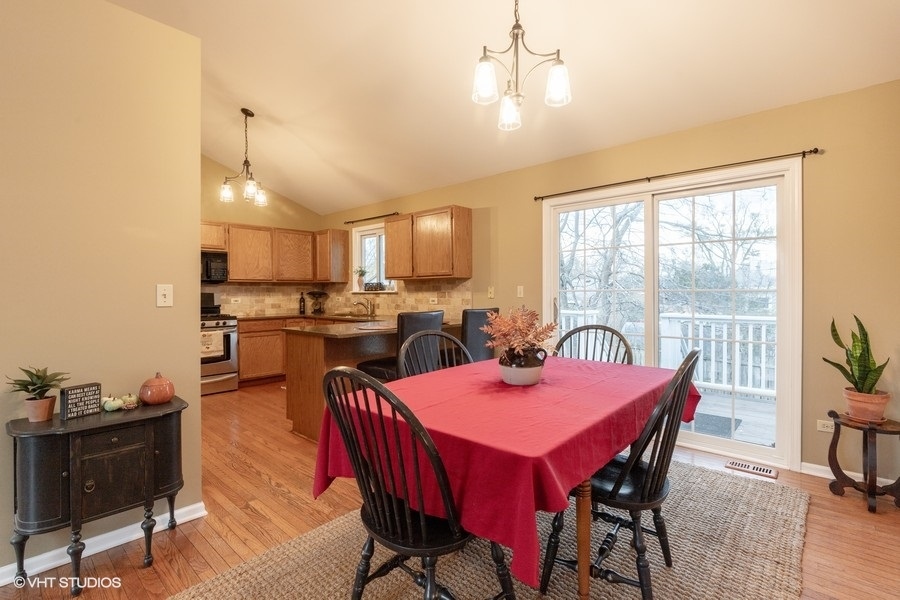 136 Tree Line Antioch, IL 60002 - Photo 5 of 17 a view of a dining room with furniture window and outside view