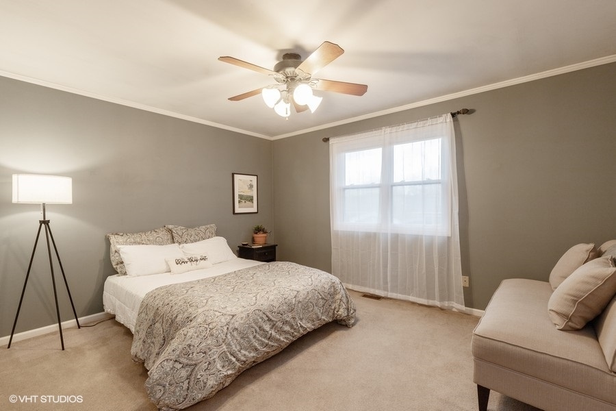 136 Tree Line Antioch, IL 60002 - Photo 7 of 17 a bedroom with a bed and window