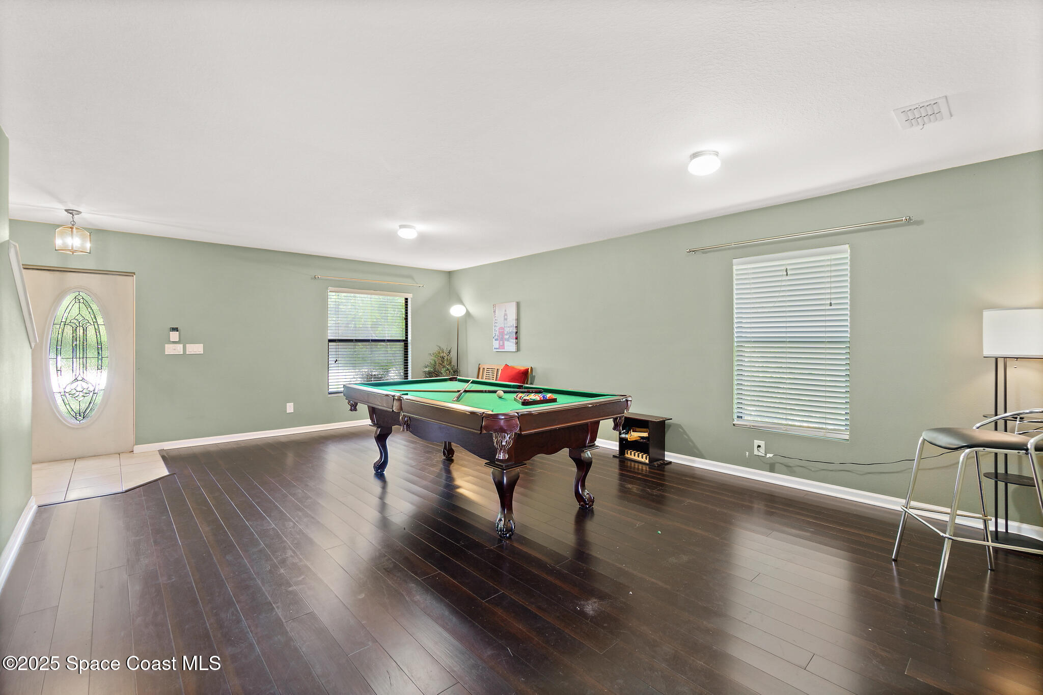285 Dryden Circle Cocoa, FL 32926 - Photo 12 of 61 a room with furniture pool table wooden floor and windows