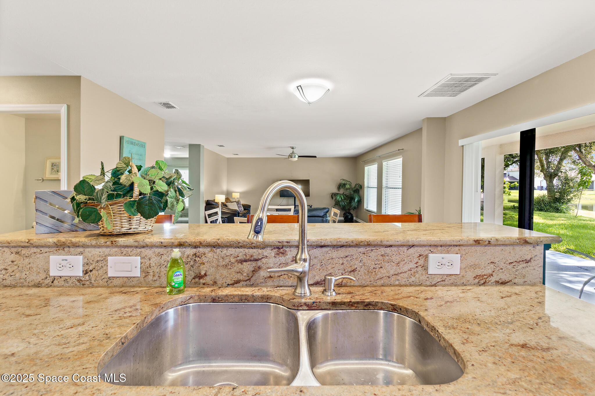 285 Dryden Circle Cocoa, FL 32926 - Photo 20 of 61 a kitchen with granite countertop a sink and a wooden floor