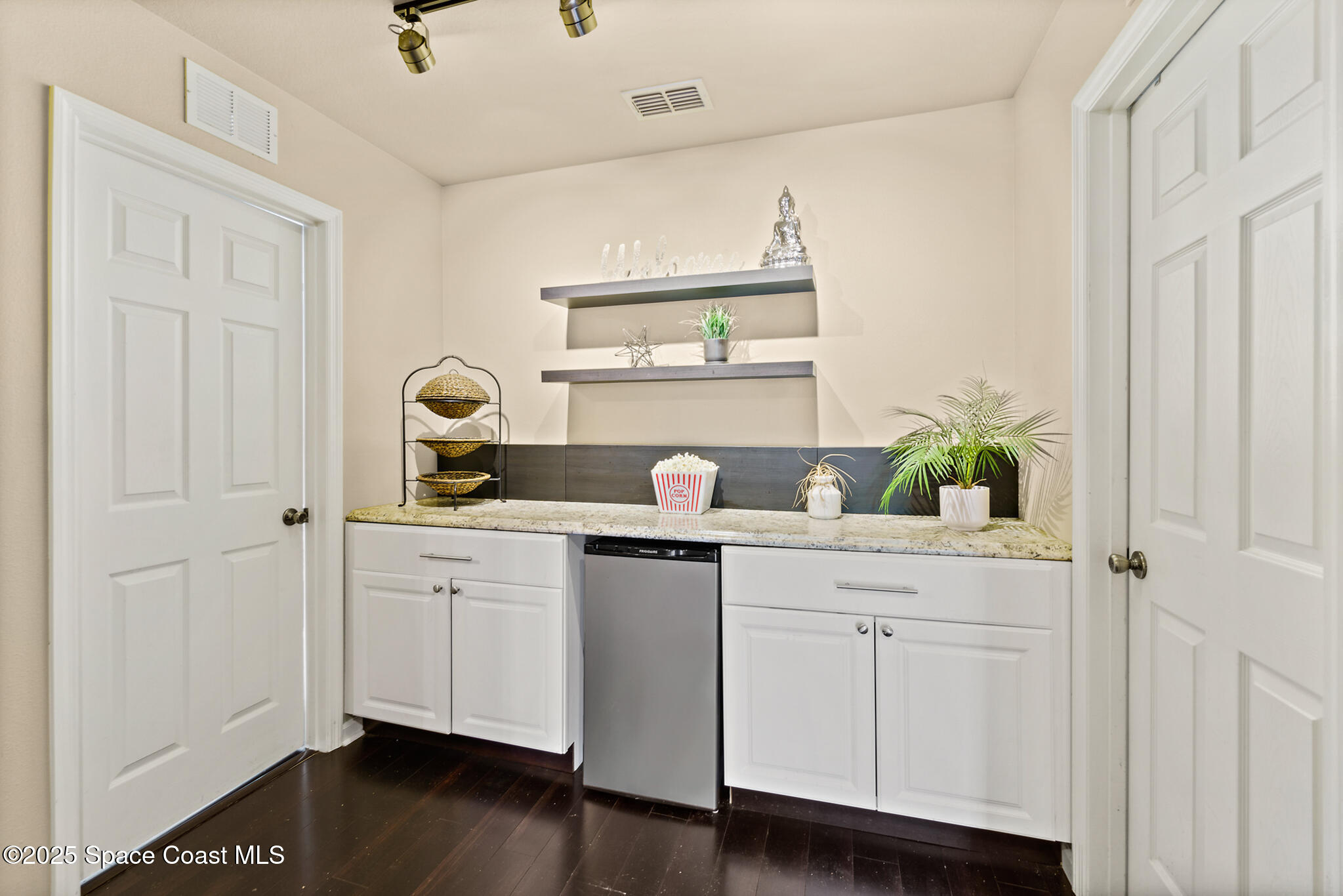 285 Dryden Circle Cocoa, FL 32926 - Photo 26 of 61 a view of cabinets a sink and a window in a room