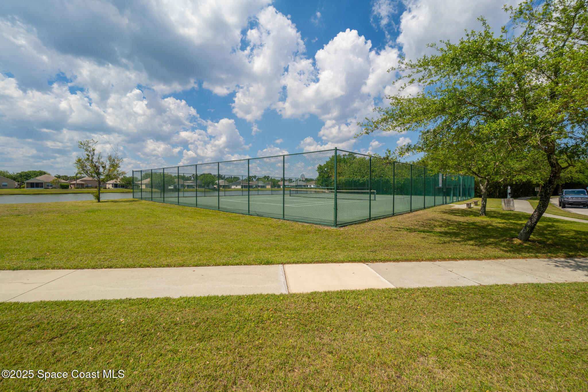 285 Dryden Circle Cocoa, FL 32926 - Photo 42 of 61 a view of a golf course with a lake