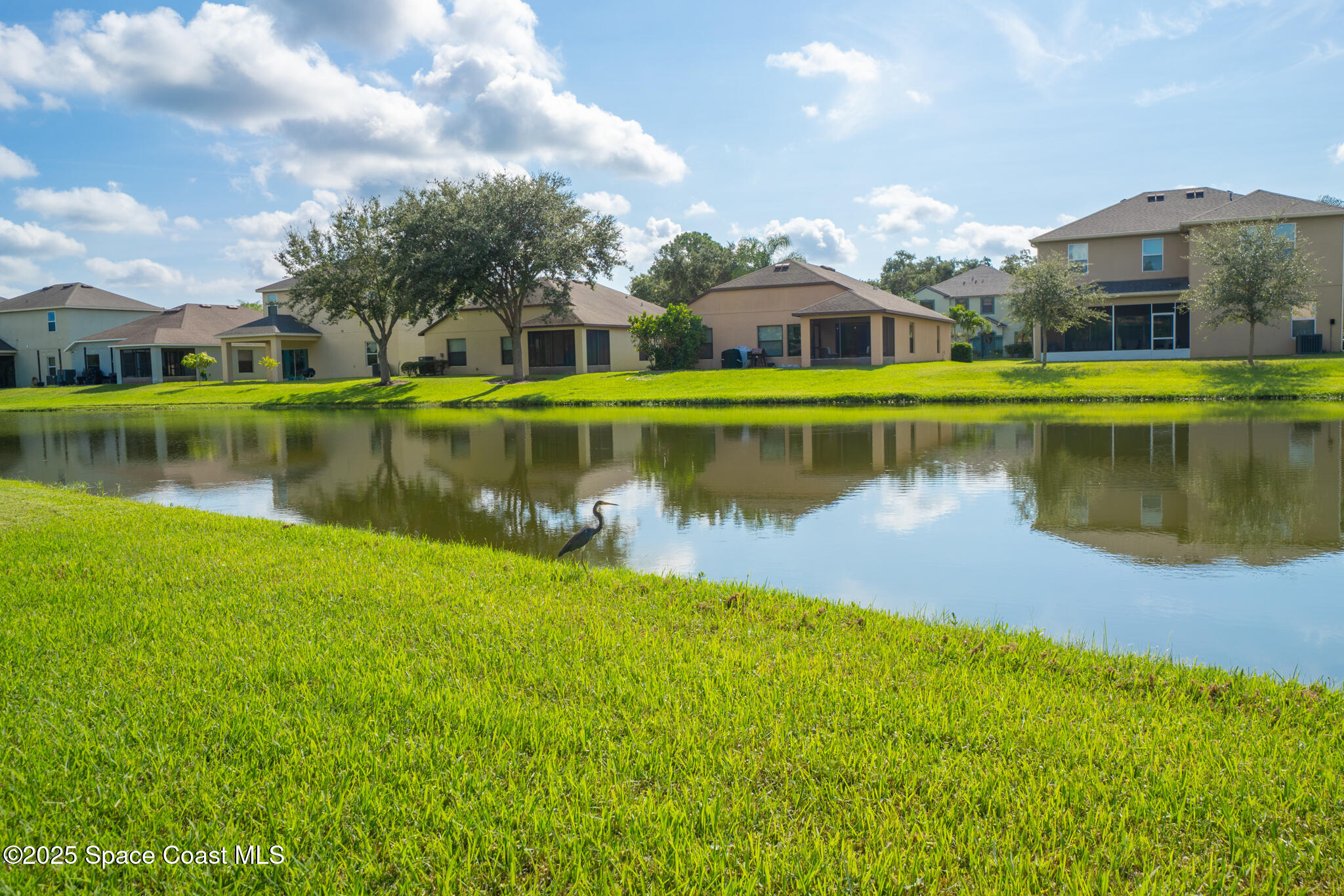 285 Dryden Circle Cocoa, FL 32926 - Photo 54 of 61 a view of a lake with houses in the background