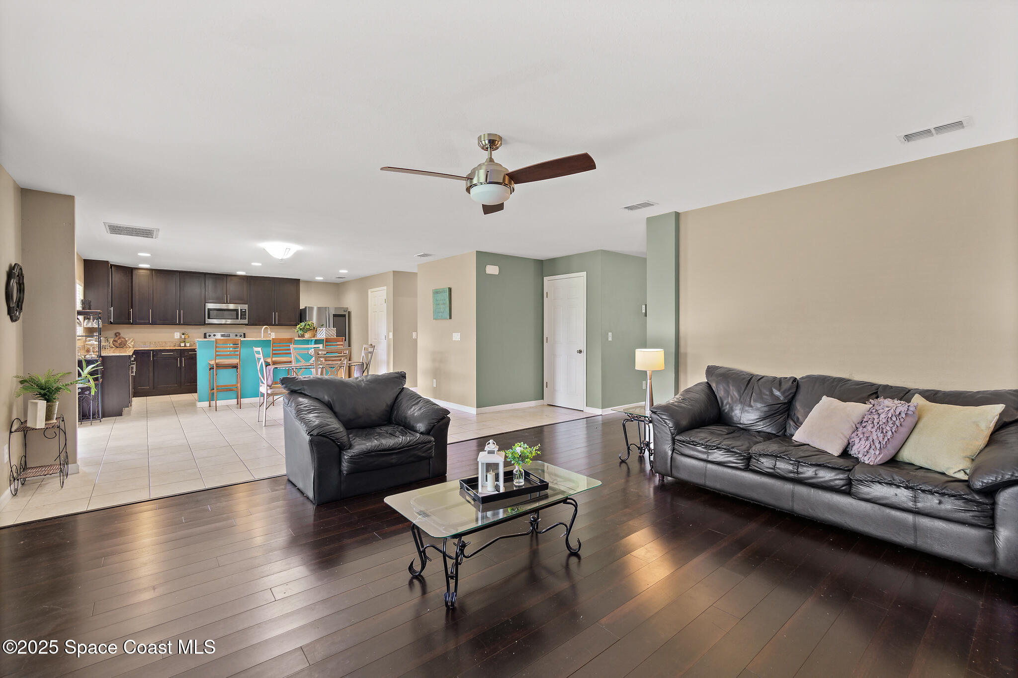 285 Dryden Circle Cocoa, FL 32926 - Photo 6 of 61 a living room with furniture and wooden floor