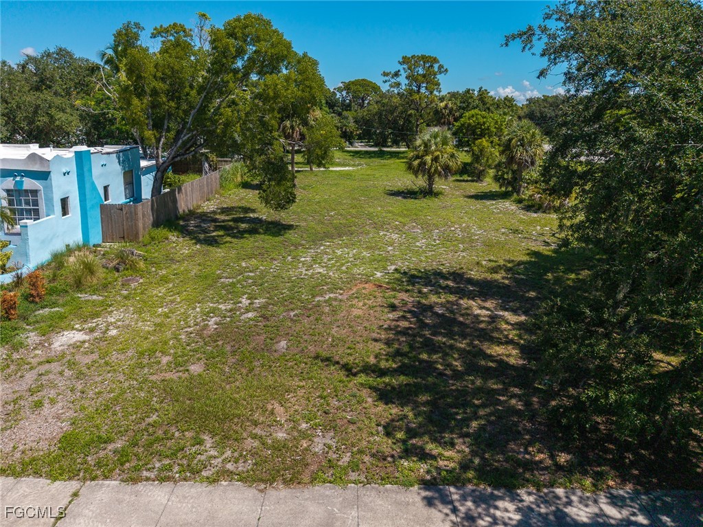 2269 Katherine Street Fort Myers, FL 33901 - Photo 5 of 6 a backyard of a house with lots of green space