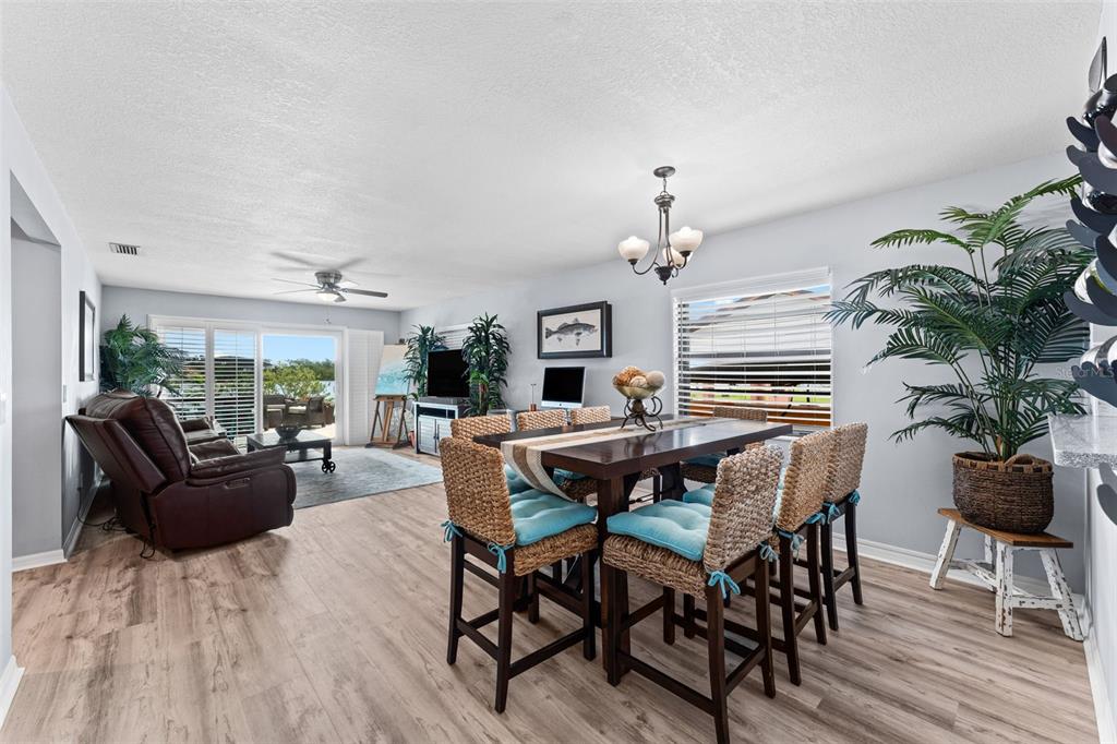 29 Pelican Lane Edgewater, FL 32141 - Photo 6 of 39 a view of a dining room with furniture window and wooden floor