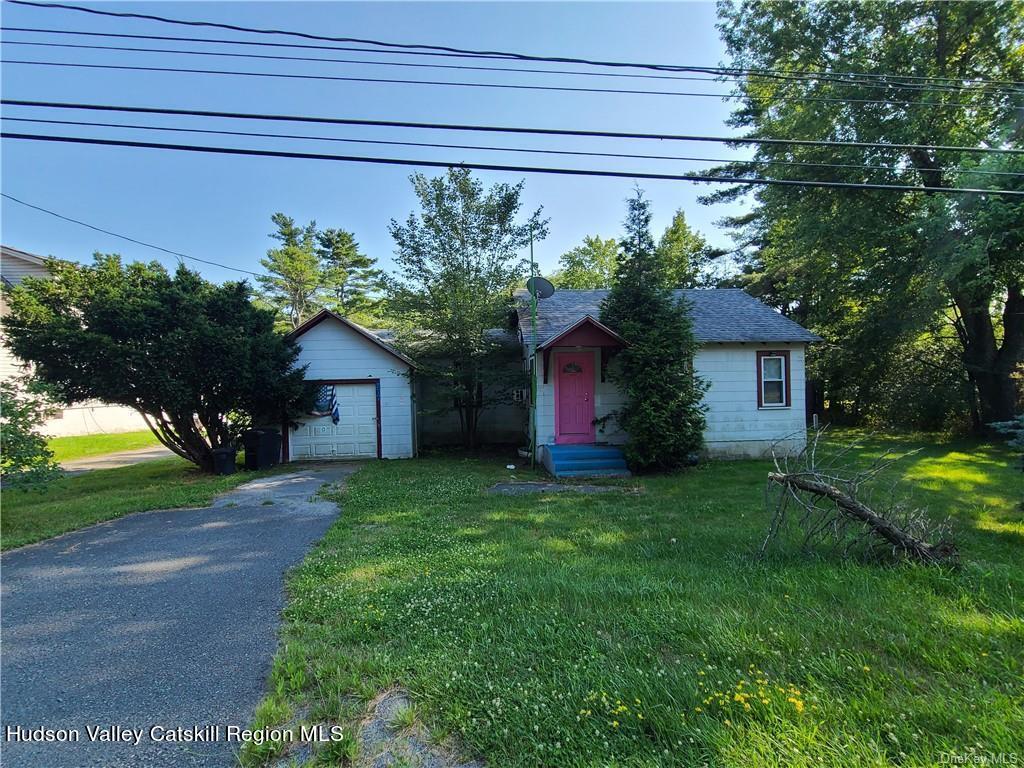 275-277 State Rt 17B Monticello, NY 12701 - Photo 11 of 32 a house view with a garden space