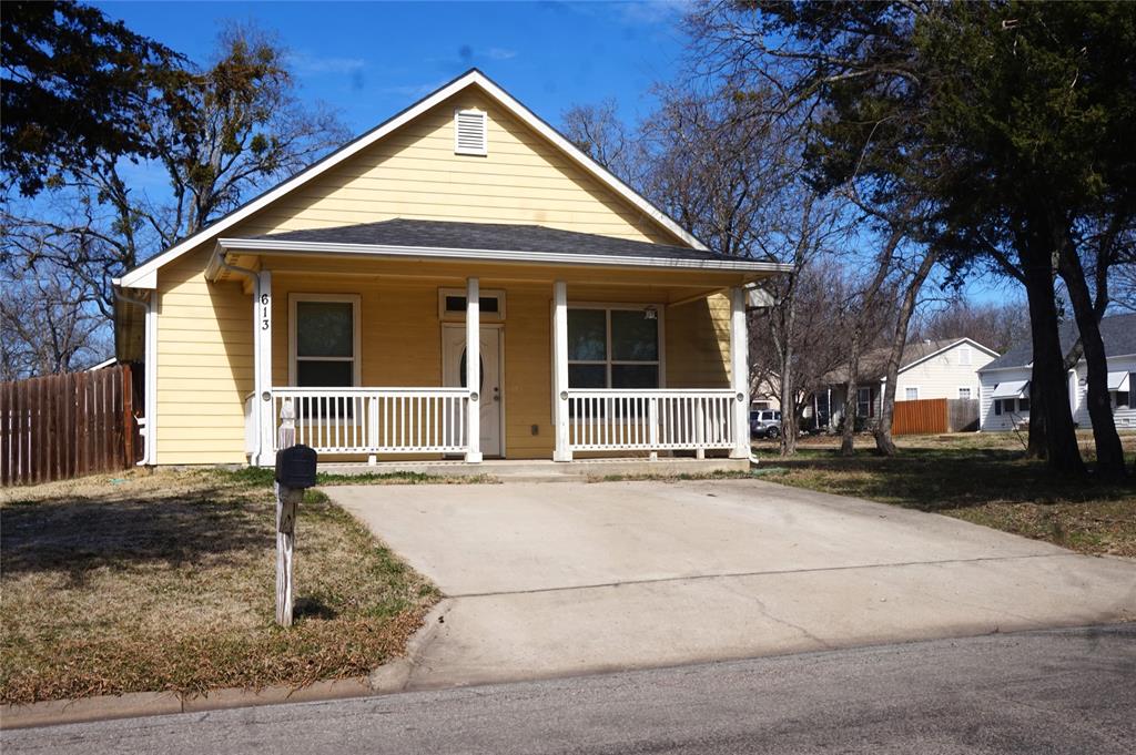 613 East Rosedale Street Sherman, TX 75090 - Photo 1 of 21 front view of a house with a yard