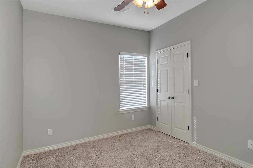 613 East Rosedale Street Sherman, TX 75090 - Photo 17 of 21 an empty room with windows and closet