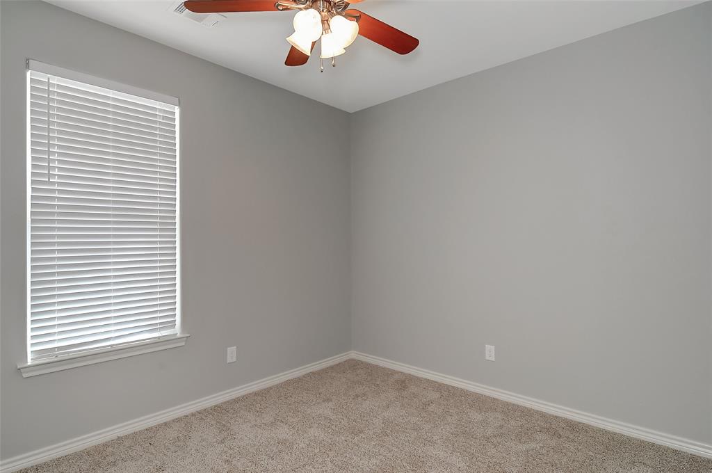 613 East Rosedale Street Sherman, TX 75090 - Photo 19 of 21 an empty room with a window