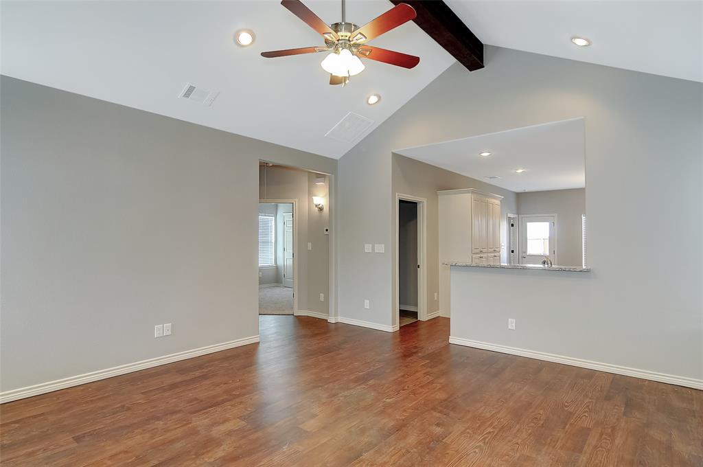 613 East Rosedale Street Sherman, TX 75090 - Photo 2 of 21 an empty room with fan and a ceiling fan