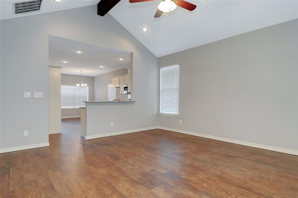 613 East Rosedale Street Sherman, TX 75090 - Photo 21 of 21 an empty room with wooden floor and windows