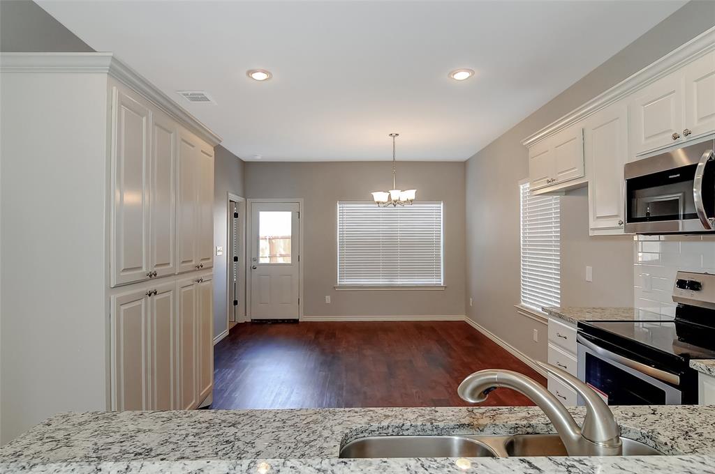 613 East Rosedale Street Sherman, TX 75090 - Photo 5 of 21 a view of a livingroom with furniture flat screen tv and windows