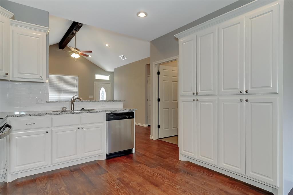 613 East Rosedale Street Sherman, TX 75090 - Photo 8 of 21 a bathroom with granite countertop a sink and a mirror