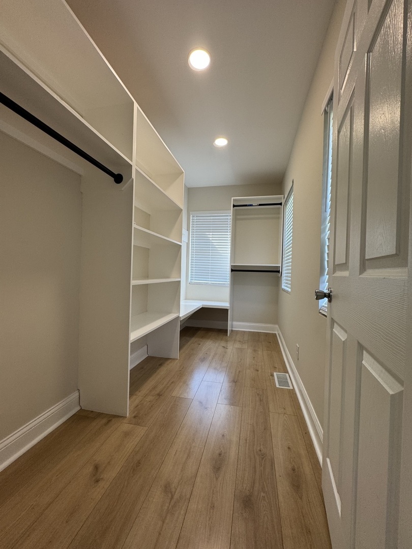 395 Surrey Lane Crete, IL 60417 - Photo 11 of 26 a view of a room with wooden floors and staircase