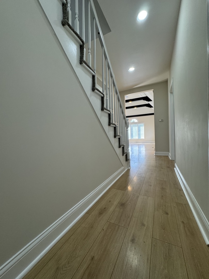 395 Surrey Lane Crete, IL 60417 - Photo 16 of 26 a view of entryway with wooden floor