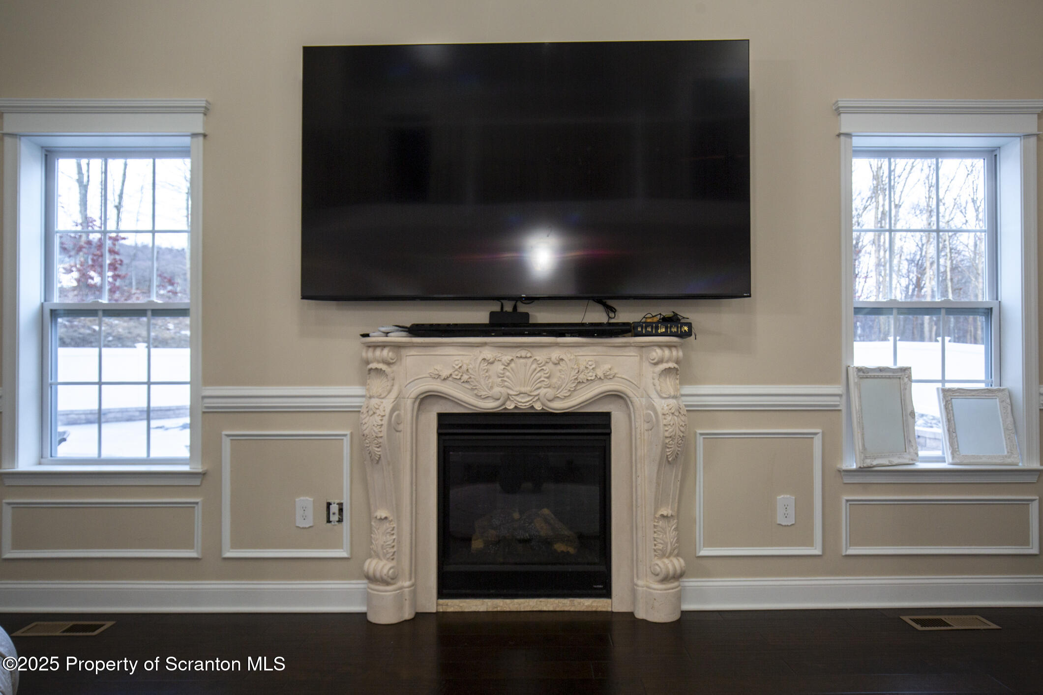 189 Long Run Road Drums, PA 18222 - Photo 30 of 72 a living room with a fireplace and a flat screen tv