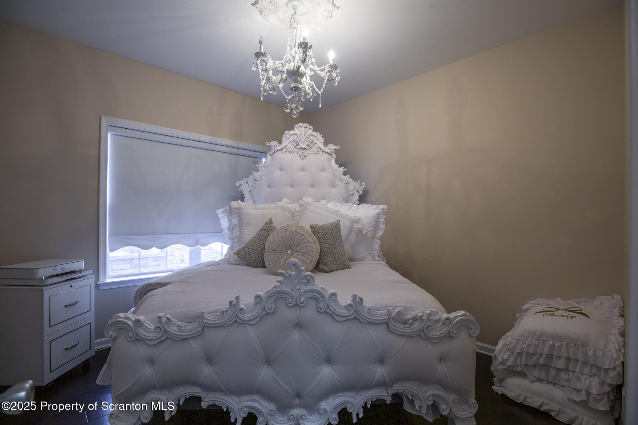 189 Long Run Road Drums, PA 18222 - Photo 42 of 72 a large bed sitting in a bedroom next to a chandelier