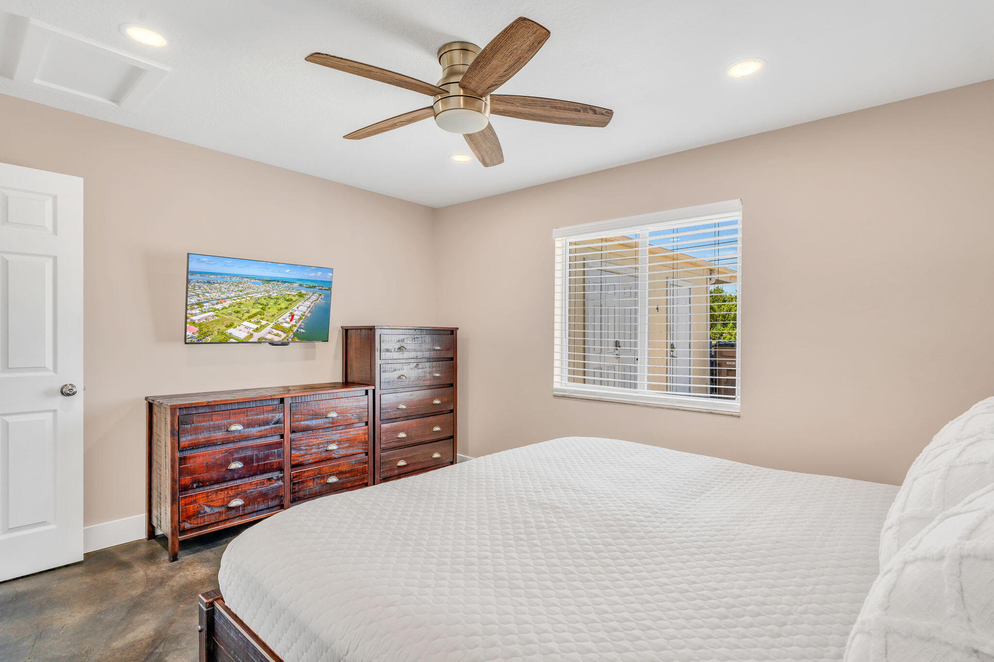 4 7th Street Key Colony Beach, FL 33051 - Photo 14 of 44 a bedroom with a bed and a flat screen tv