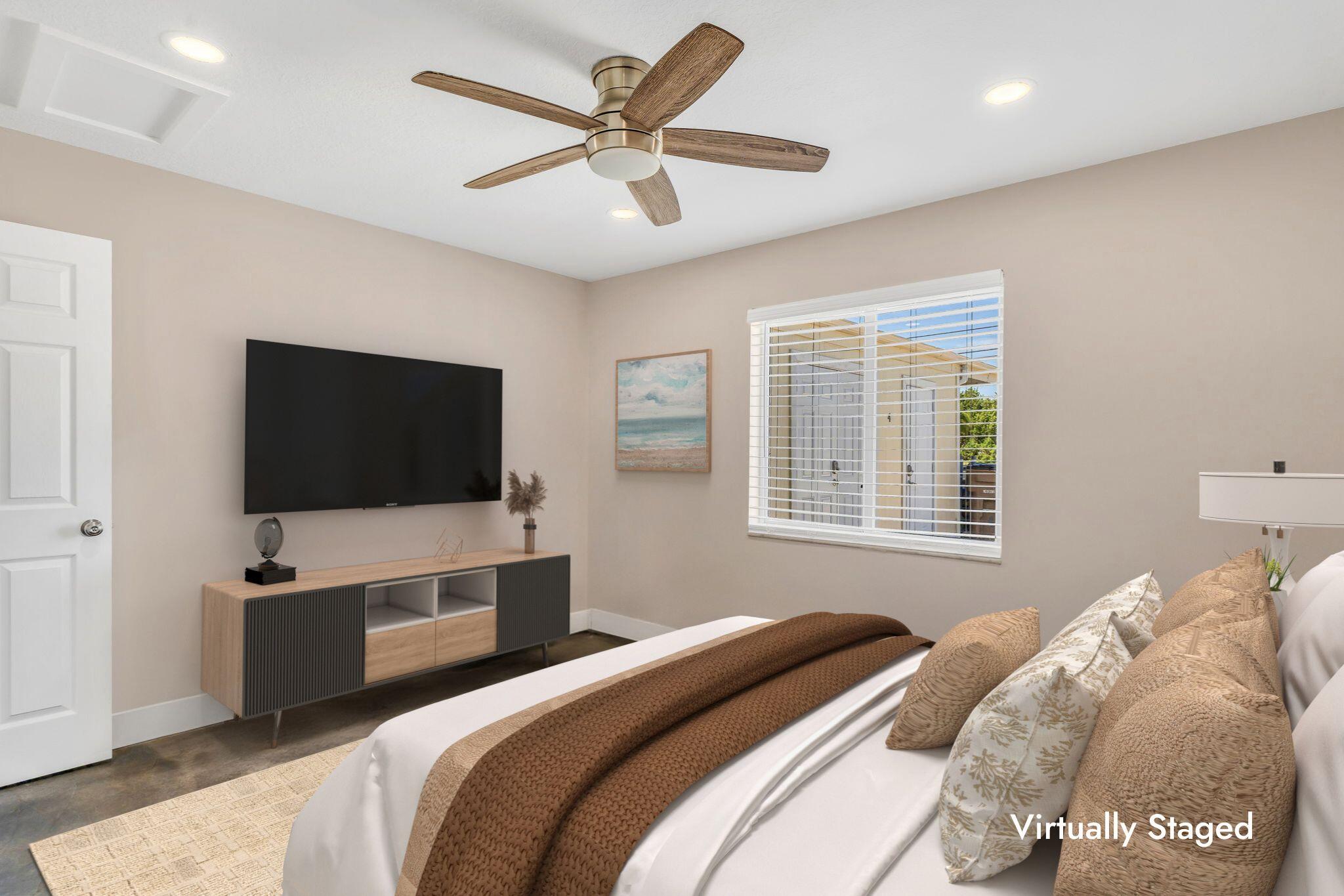 4 7th Street Key Colony Beach, FL 33051 - Photo 15 of 44 a bedroom with a bed tv and a window