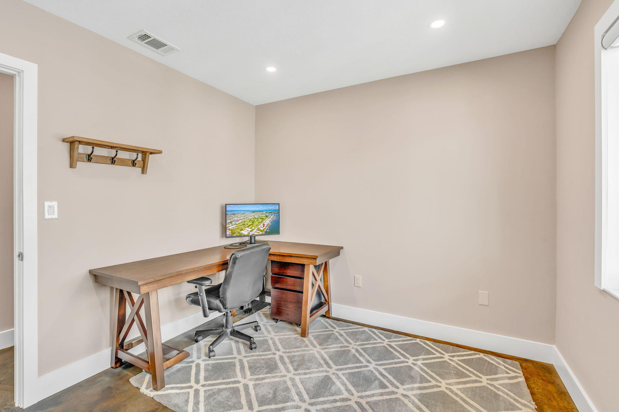 4 7th Street Key Colony Beach, FL 33051 - Photo 17 of 44 a workspace with furniture and wooden floor